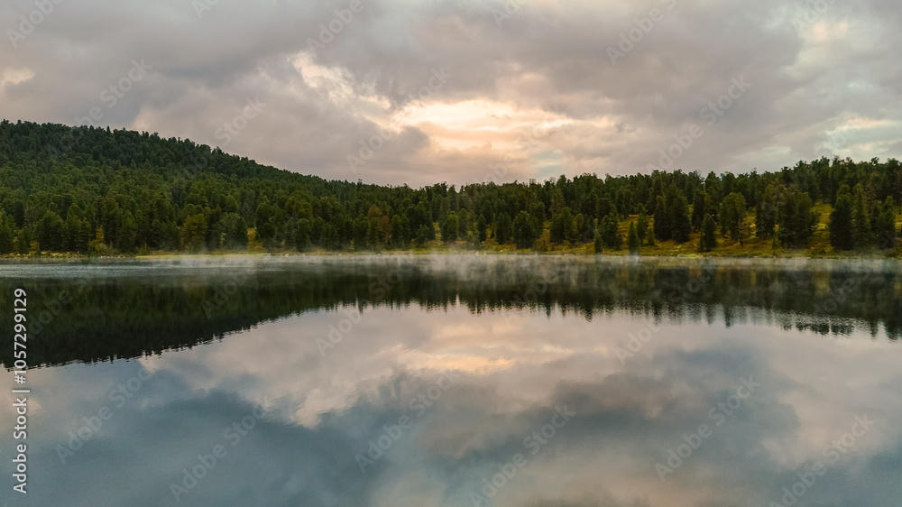 the lake is Bright at sunset, filmed from a drone the lake is Bright at sunset, filmed from a drone