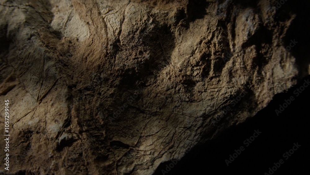 Weathered rock surface with light shadow play Weathered rock surface with light shadow play
