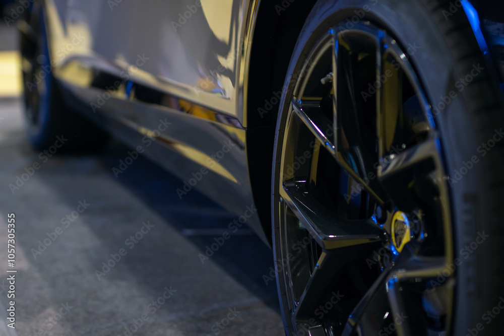 Stylish Black Alloy Wheels with a Sleek Reflection of the Car Body Presenting Elegance Stylish Black Alloy Wheels with a Sleek Reflection of the Car Body Presenting Elegance