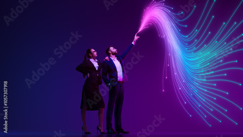 Принти на полотні Businesswoman and man observe flowing wave of digital data against gradient vibrant background