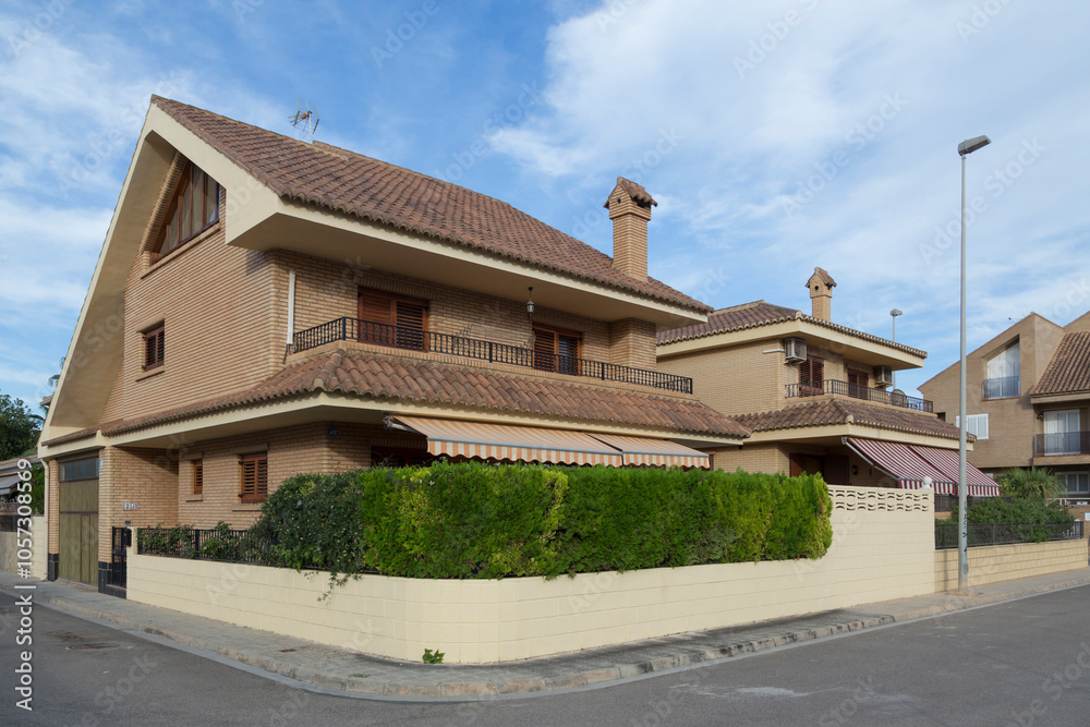 Detached house with awnings, two floors, view from the street, luxury villas in Sagunto, Valencia, Spain Detached house with awnings, two floors, view from the street, luxury villas in Sagunto, Valencia, Spain