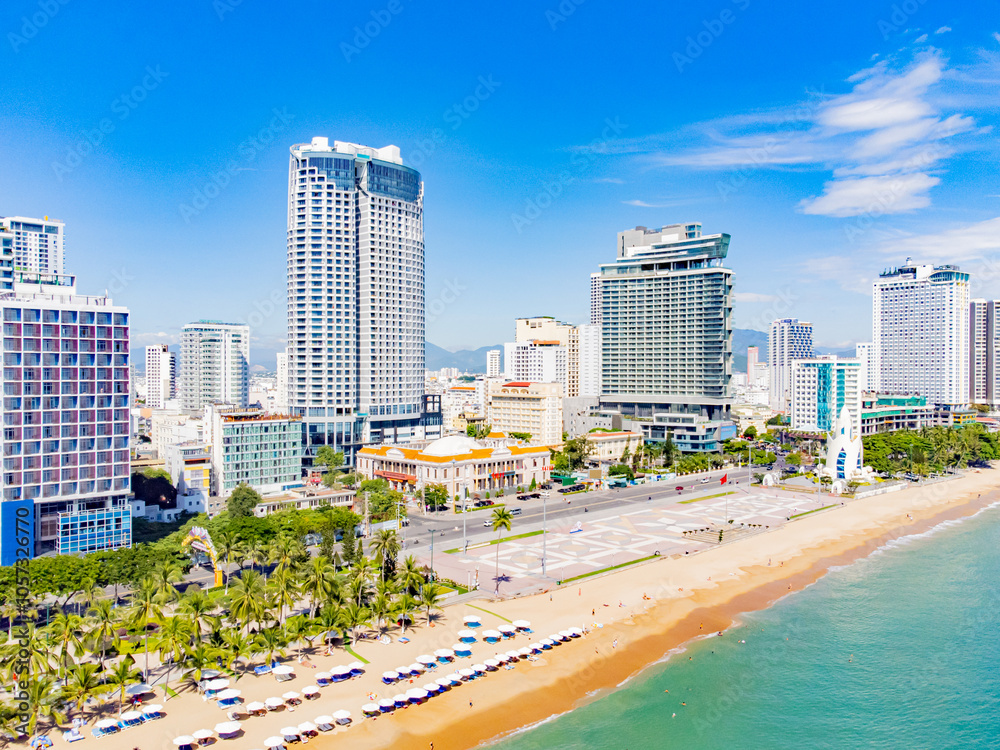 Obraz premium The sea promenade of the city.Nha Trang is a resort city in Vietnam. It's a sunny day. Shooting from a drone.