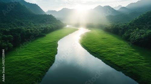 A scenic river wends its way through a lush mountainous terrain, reflecting the tranquil beauty and serene tranquility of the untouched natural environment.