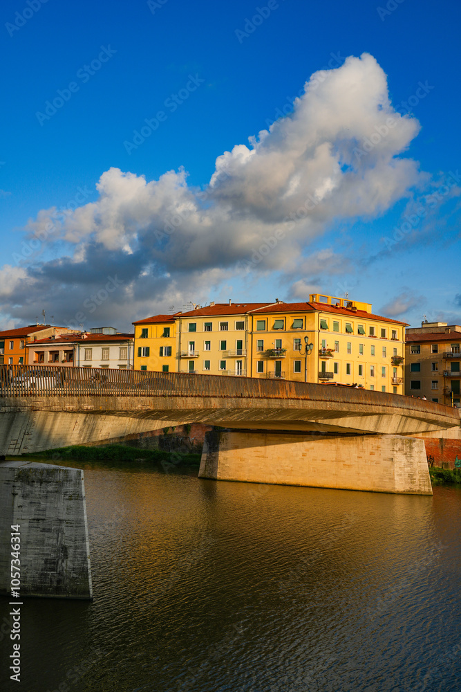 Fototapeta premium Summer sunset landscape of Pisa old city and the embankment of Arno river, Italy, Europe 