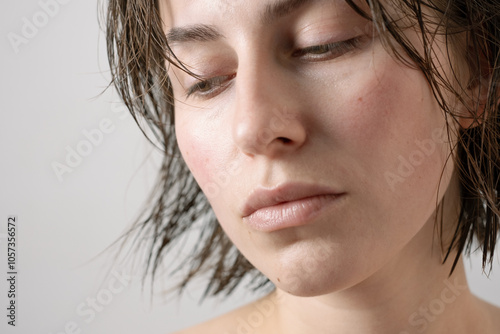 Young woman showcasing her clear skin in close-up