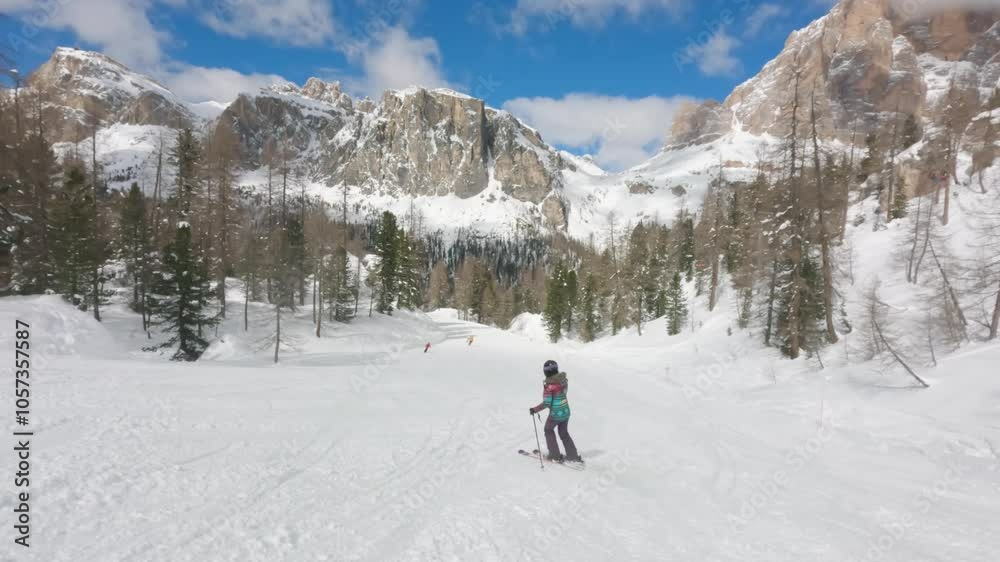 Young Girl Ski on Cortina Slope in Dolomites Mountain, Italian Alps Young Girl Ski on Cortina Slope in Dolomites Mountain, Italian Alps