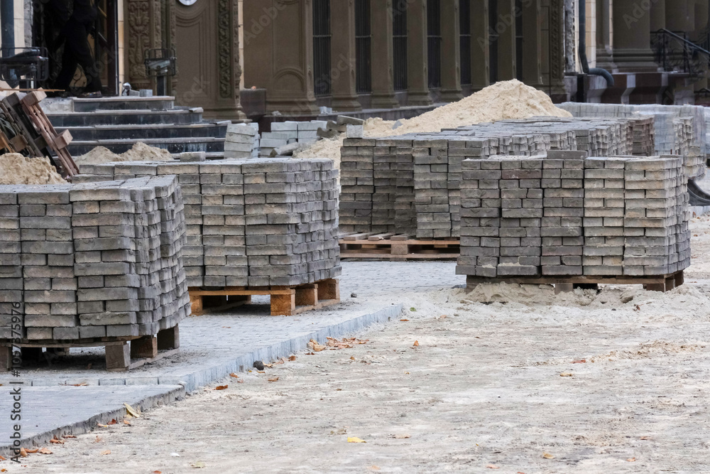 The construction site has neatly arranged stacks of highquality paving stones available for immediate use, enabling the efficient creation of beautiful pathways and enhanced outdoor spaces The construction site has neatly arranged stacks of highquality paving stones available for immediate use, enabling the efficient creation of beautiful pathways and enhanced outdoor spaces