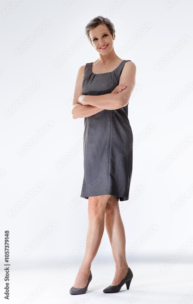 Portrait, arms crossed and mature business woman in studio for pride on white background. Smile, confident professional and creative manager, happy entrepreneur and expert director working in Iceland