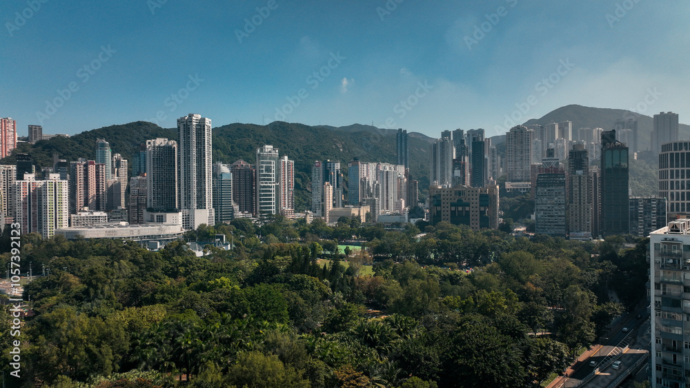 Fototapeta premium View of Hong Kongs skyline and lush greenery on a clear day capturing urban and natural beauty