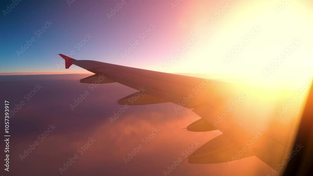 Captivating sunset views from an airplane wing over the clouds during a serene flight Captivating sunset views from an airplane wing over the clouds during a serene flight