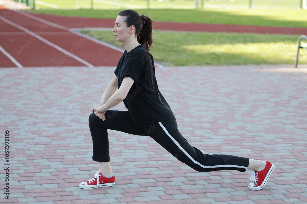 Fototapeta premium Woman doing workout exercises outside