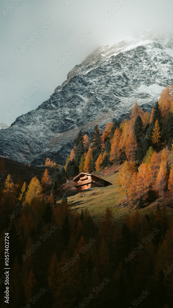 Stunning mountain scenery in fall with old farmhouse at sunrise, Osttirol region, Tyrol, Austria