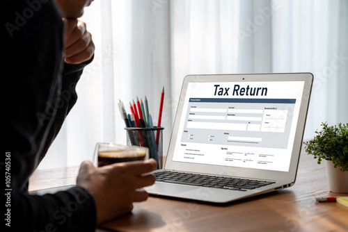 Online tax return form for submitting individual income tax return form snugly on the internet website. Government web for tax payment and return. Taxation technology concept. photo