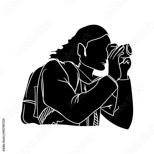 Silhouette of a young man who likes to take pictures