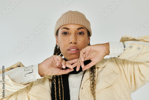 Good looking african american woman in autumn stylish attire on white backdrop. photo