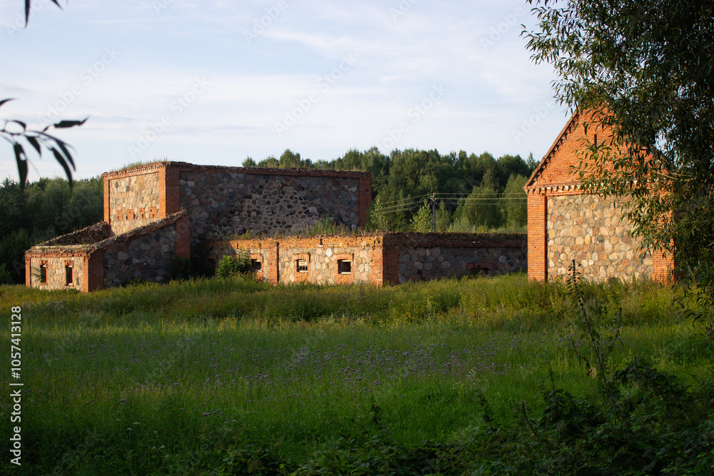 Old ruined utility building from red bricks and stones. Belarussian culture. Old ruined utility building from red bricks and stones. Belarussian culture.