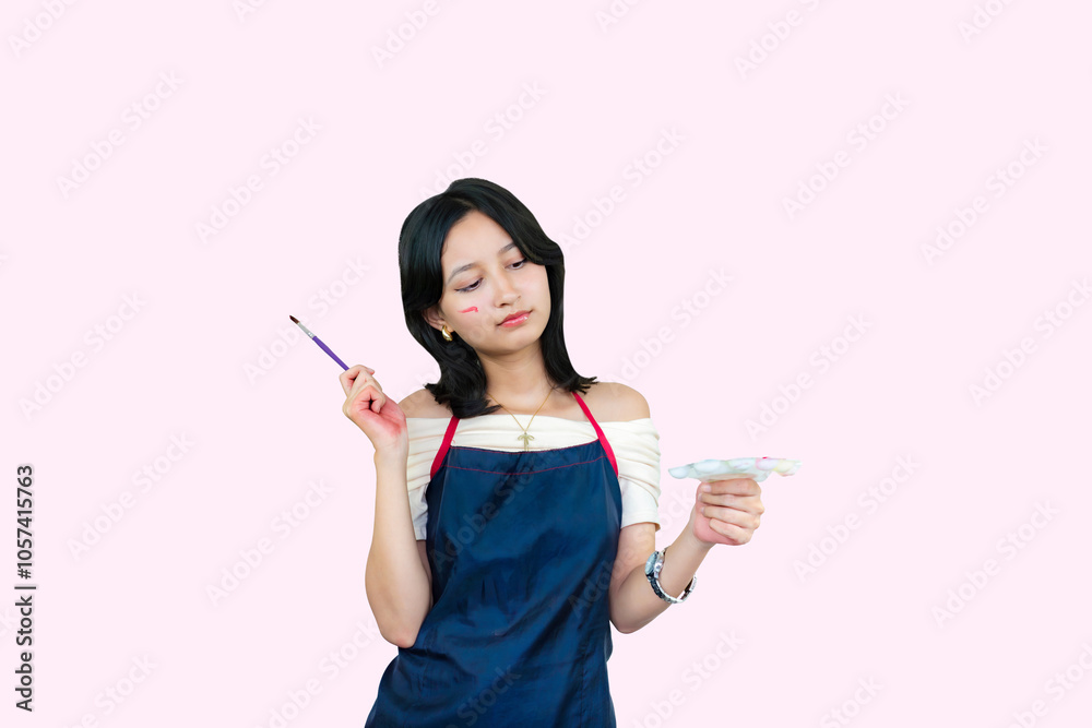 Young Painter Girl Artist Giving Expression and Gestures with paintbrush and canvas on table art Young Painter Girl Artist Giving Expression and Gestures with paintbrush and canvas on table art
