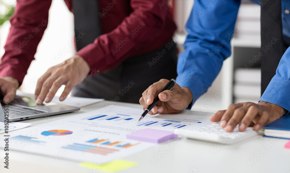 Businessman meeting with colleagues are discussing business situation analysis by charts in financial reports and making plans to increase company profits. Businessman meeting with colleagues are discussing business situation analysis by charts in financial reports and making plans to increase company profits.
