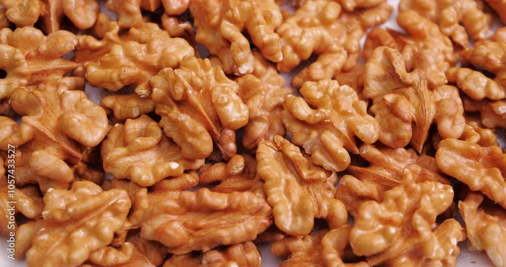 Walnut Halves Rotating on a White Background. Raw healthy ingredient Concept. Vegan Food Walnut Halves Rotating on a White Background. Raw healthy ingredient Concept. Vegan Food