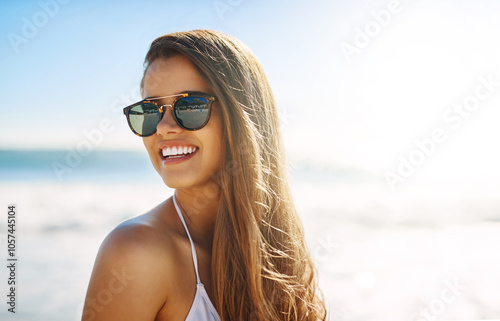 Happy, woman and thinking with sunglasses at beach for summer fun, peace and break on vacation. Ocean, sunshine and female person with confidence by water for holiday, adventure and weekend getaway