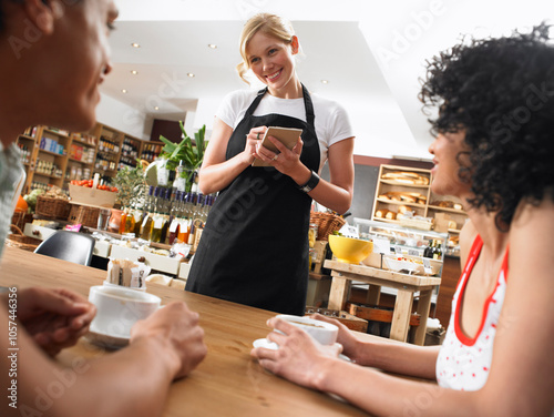 Couple and Waitress in Cafe photo