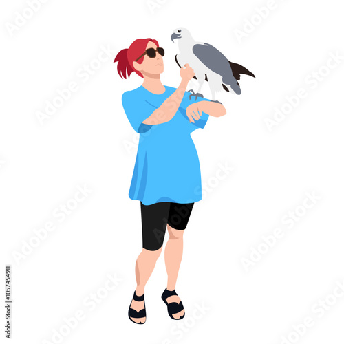 A woman and a bird. An eagle in the hands of a man. A bird of prey. A girl in casual clothes. Ornithologist