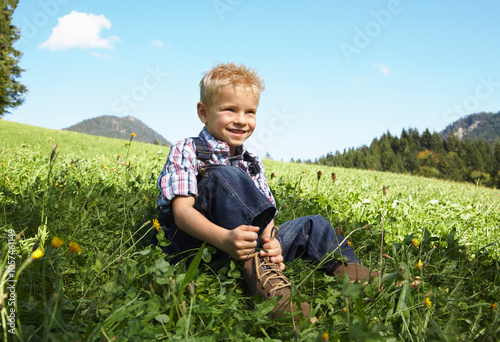 Boy Tying his Shoelaces