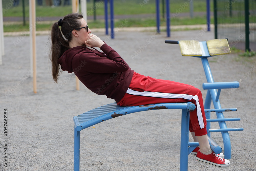 Fototapeta premium Woman exercising or doing workout session outside 