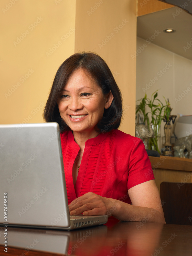 Woman in Restaurant with Laptop Computer