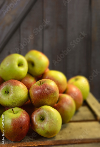 Germany, Braeburn apples on wood photo