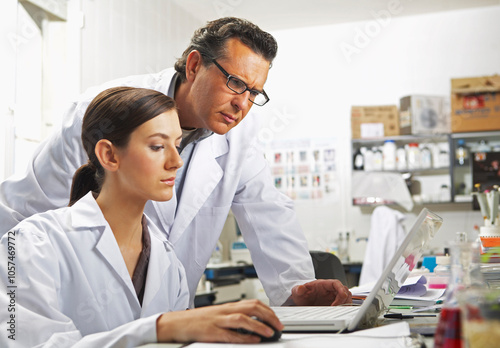 Scientists Using Laptop Computer photo