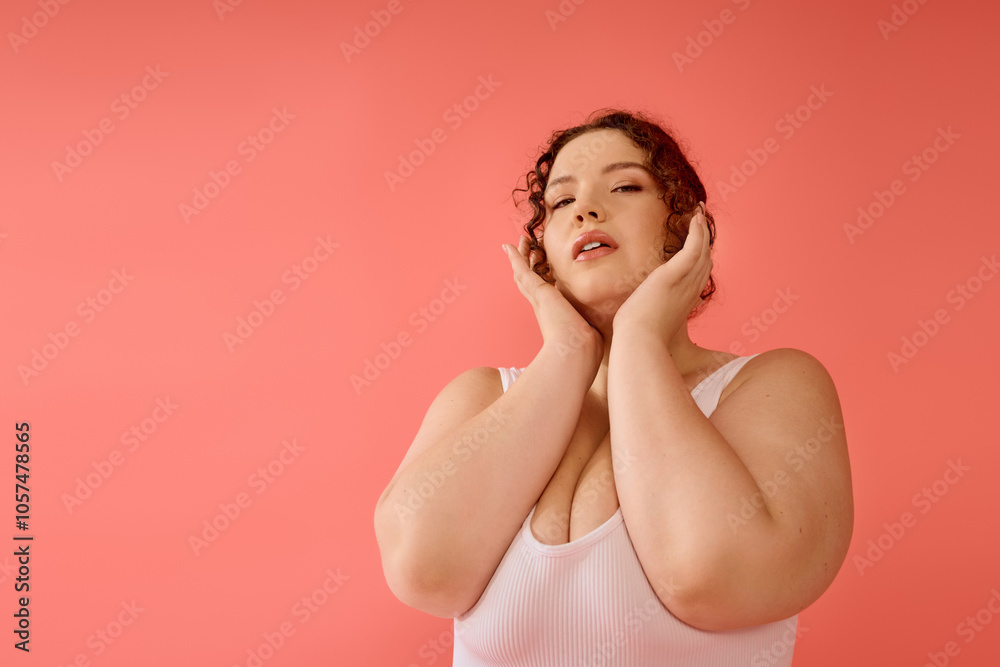 A stunning plus size woman poses confidently against a vibrant backdrop, showcasing her beauty.