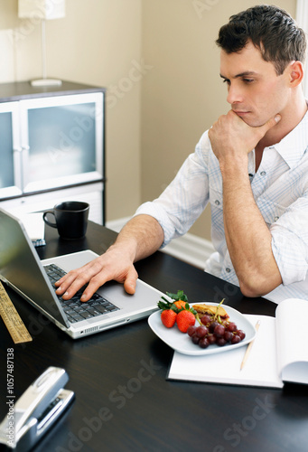 Man Using Laptop Computer photo