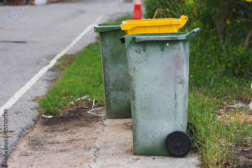 Green plastic trash cans in public places