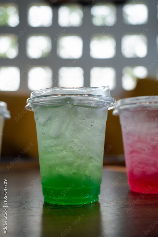 Iced green Italian soda in take a glass, Refresh drink Iced green Italian soda in take a glass, Refresh drink