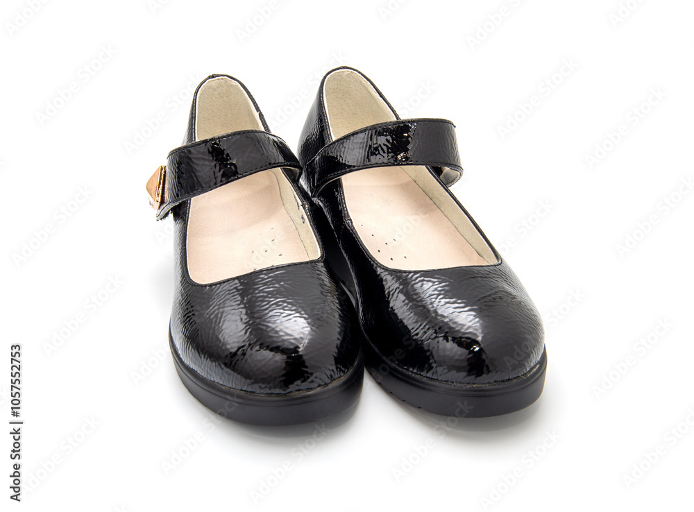 Pair of little black girl's shoes isolated on the white background. Pair of little black girl's shoes isolated on the white background.
