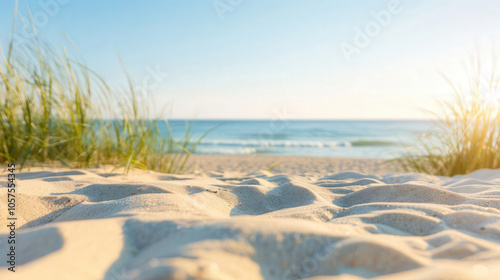 Golden grains of fine beach sand glistening under the warm summer sun, creating a tranquil and inviting coastal atmosphere, perfect for relaxation and leisure. photo