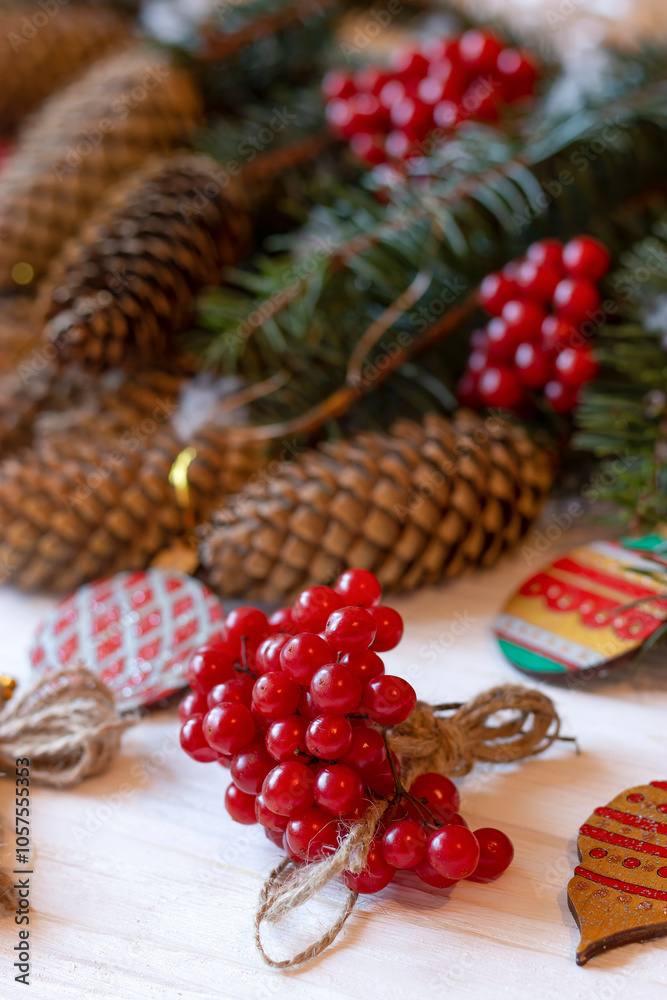 DIY decorations for Christmas. Rural style Christmas with eco-conscious details: snowball tree, cones and wooden handmade decorations for the Xmas tree on pine branches. New Year natural wooden toys. DIY decorations for Christmas. Rural style Christmas with eco-conscious details: snowball tree, cones and wooden handmade decorations for the Xmas tree on pine branches. New Year natural wooden toys.