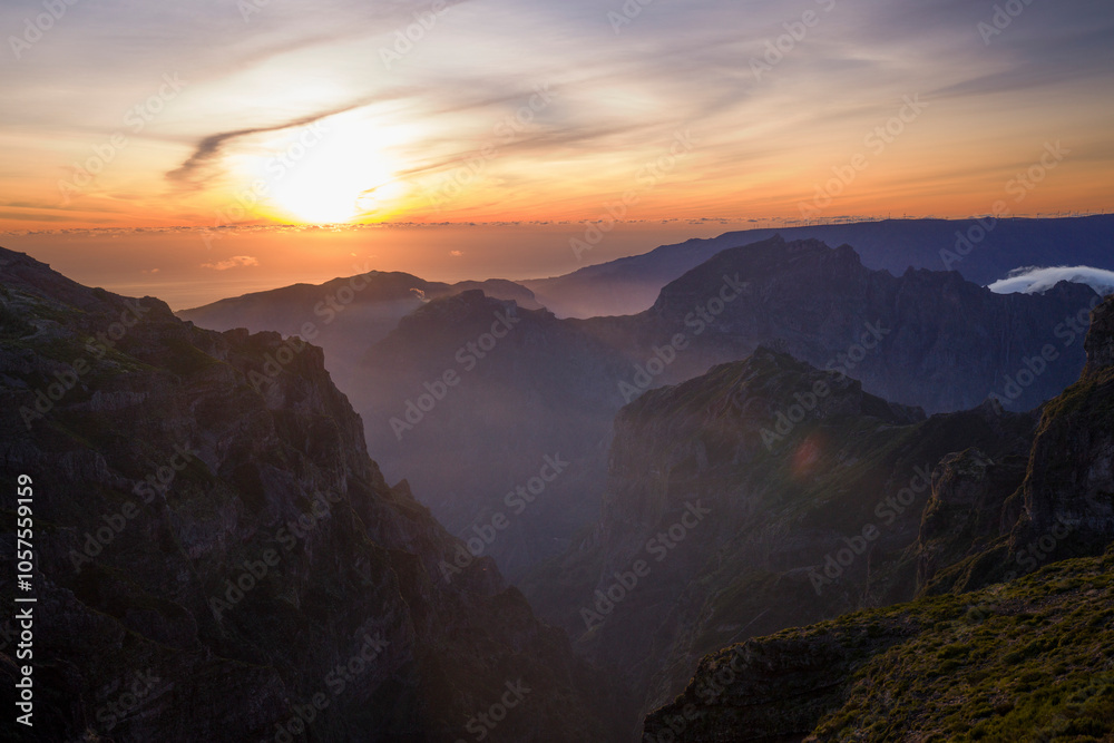 Setting sun above the clouds from Pico do Areeiro, Madeira island's third highest peak, Portugal; Sao Roque do Faial, Madeira, Portugal Setting sun above the clouds from Pico do Areeiro, Madeira island's third highest peak, Portugal; Sao Roque do Faial, Madeira, Portugal