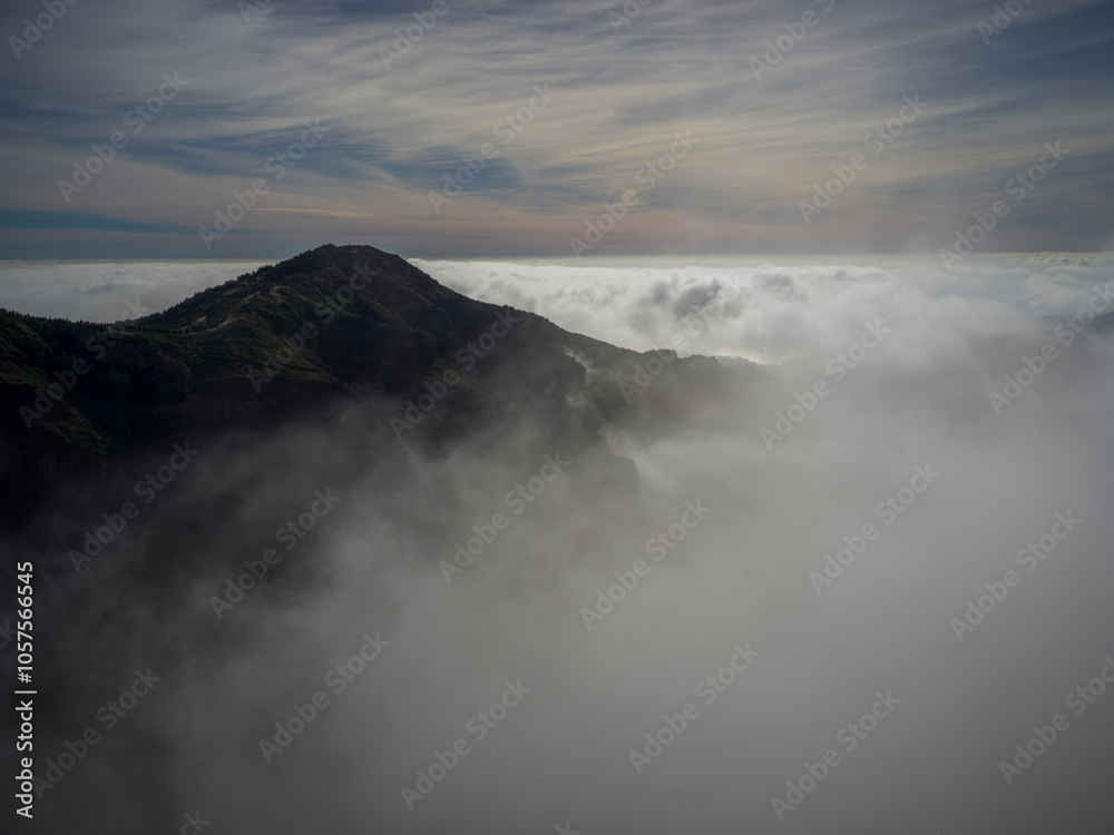 Beautiful clouds surround the summit of the high altitude hiking destination of Pico do Areeiro on the island of Madeira, Portugal; Sao Roque do Faial, Madeira, Portugal Beautiful clouds surround the summit of the high altitude hiking destination of Pico do Areeiro on the island of Madeira, Portugal; Sao Roque do Faial, Madeira, Portugal