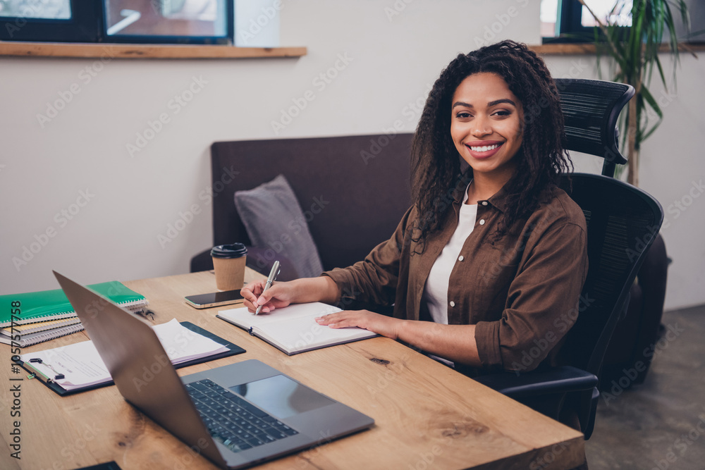 Portrait of corporate business lady pen write notepad laptop desk wear shirt modern interior office indoors Portrait of corporate business lady pen write notepad laptop desk wear shirt modern interior office indoors