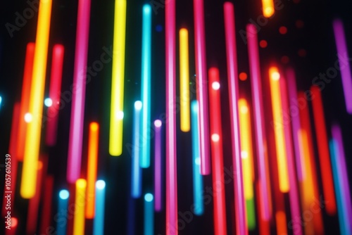 Colorful vertical light streaks creating an abstract art display at night in ...