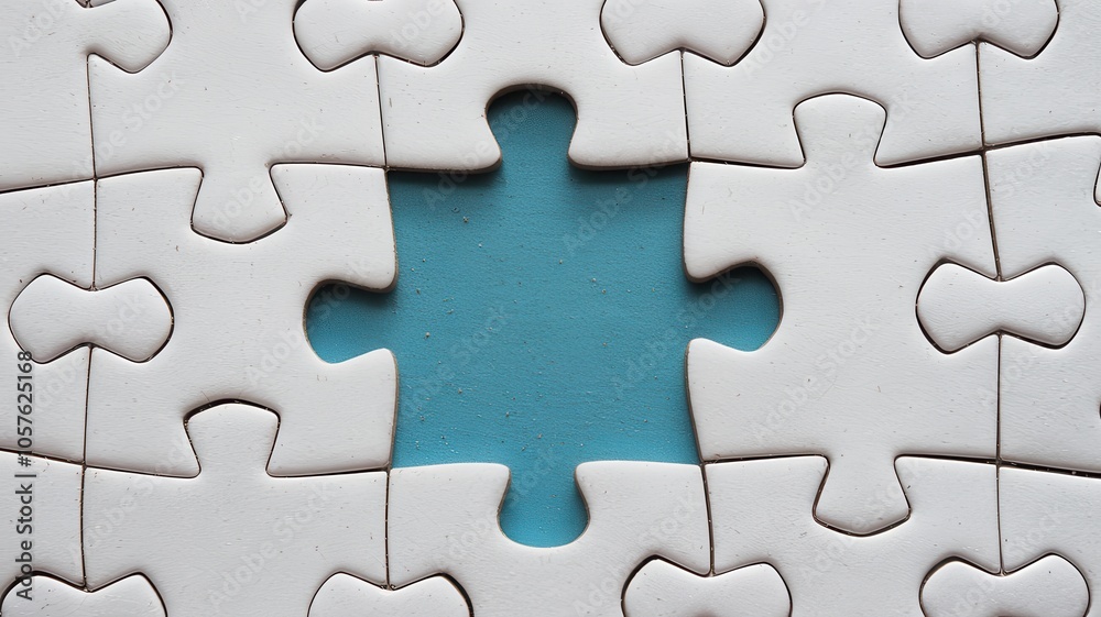 Close-up of blue and white jigsaw puzzle with one missing piece Close-up of blue and white jigsaw puzzle with one missing piece