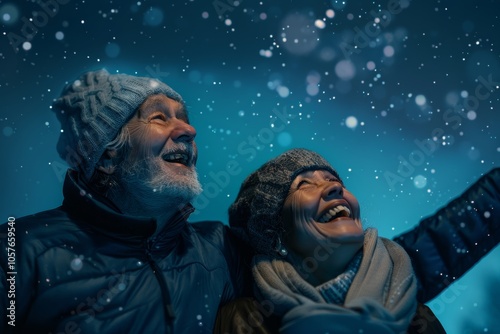 Portrait of a happy multicultural couple in their 80s showing off a lightweight base layer on sparkling night sky photo