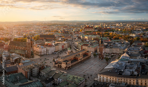 Colorful panorama of Old Town in Krakow, Poland during autumn (View of St. Mary - Mariacki Church, Main Square, Cloth Hall - Sukiennice, Town Hall tower and Wawel Castle)