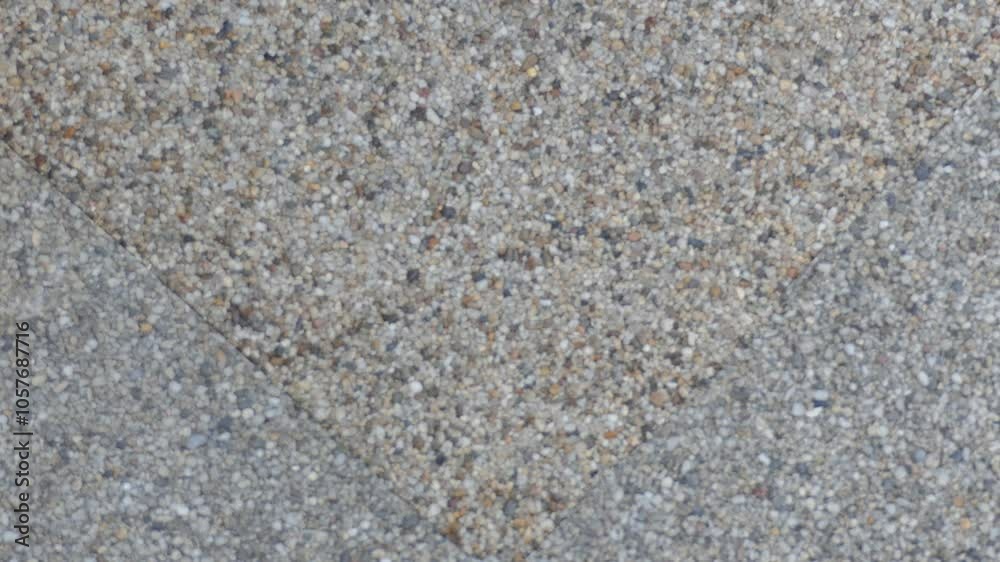 A background video of a sandy textured paving slab. A background video of a sandy textured paving slab.