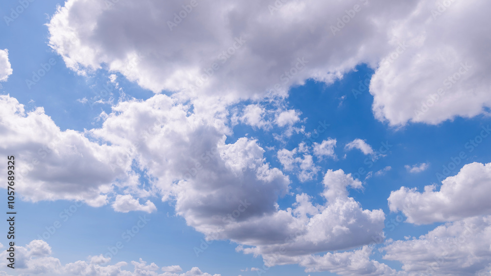 Fototapeta premium clear blue sky background,clouds with background, Blue sky background with tiny clouds. White fluffy clouds in the blue sky.