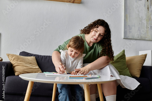 A mother and daughter bond while creating art together. photo