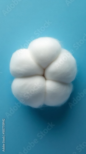 Soft white cotton balls arranged in a flower shape