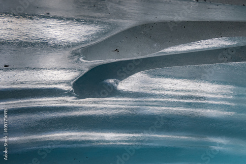 Ice cave in the glacier of Langgletscher at Lötschental in Wallis, Switzerland photo